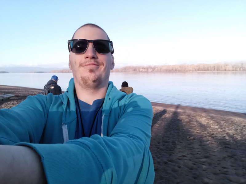 A selfie I took with my dad (left) and Uncle Darryl (right) in the background from February 2022 on Sauvie Island.