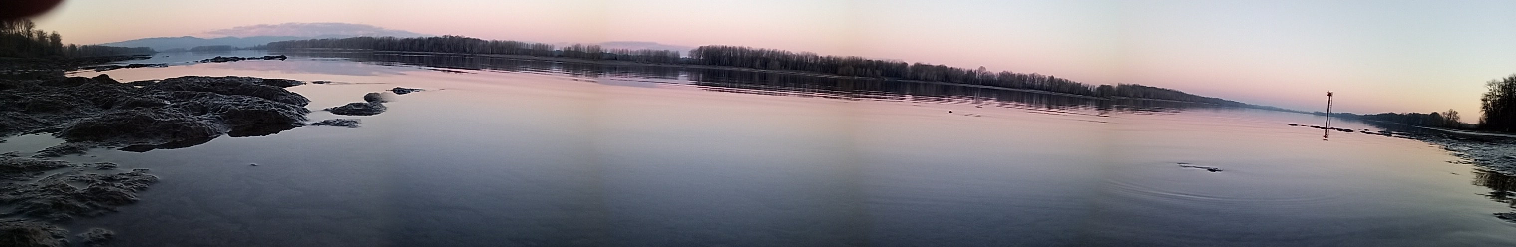 A Panoramic Photo taken by me, Danny Grogg in February 2022, from Sauvie Island at Sunset, looking North-Northeast across the Columbia River, just one foot above the surface of the water.