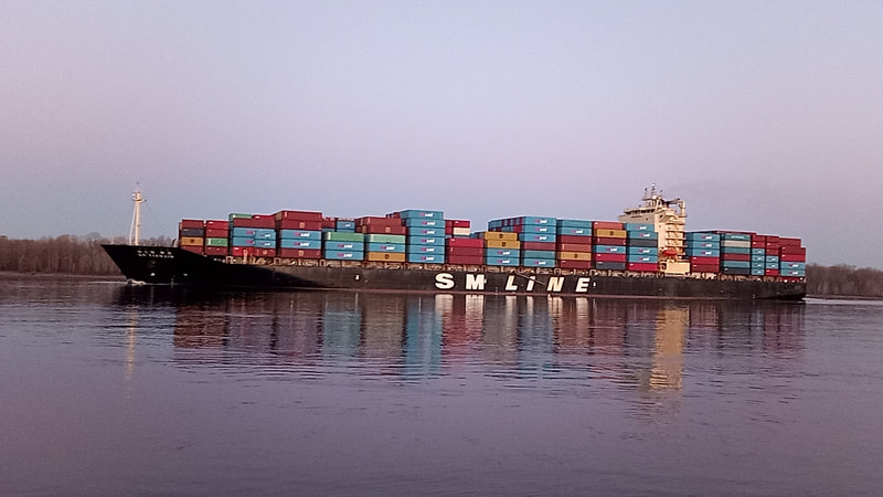 SM Line Cargo Ship fresh from the Port of Portland, sailing down the Columbia River in February 2022, past Sauvie Island