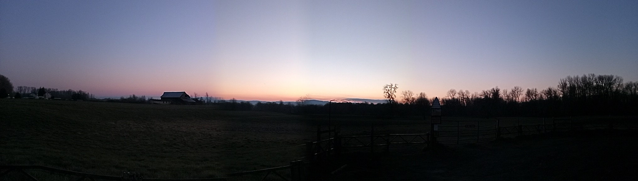 Panorama of the Sunset Silhouette over the farm on Sauvie Island, February 2022